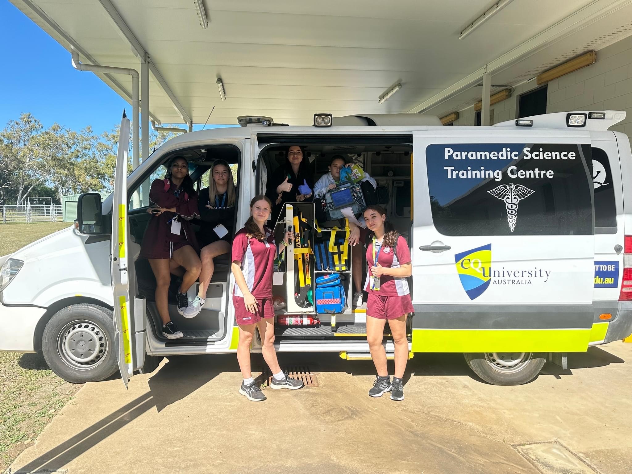 North Rockhampton High School students posing in an ambulance parked at CQU Rockhampton