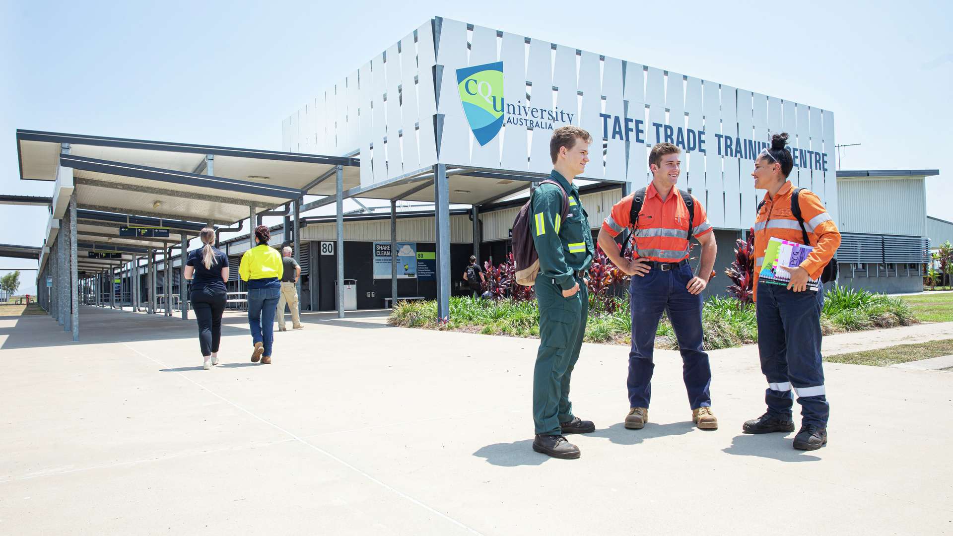 Three Apprenticeship students wearing PPE standing together out the front of the Mackay Trade Centre