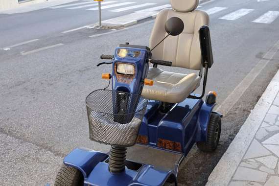 A mobility scooter parked in a street