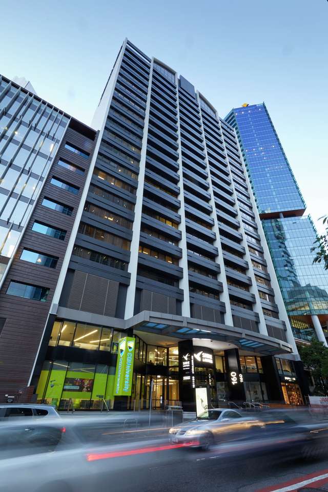 A low angle view of the exterior of the CQU Brisbane City Campus high-rise building in Queensland