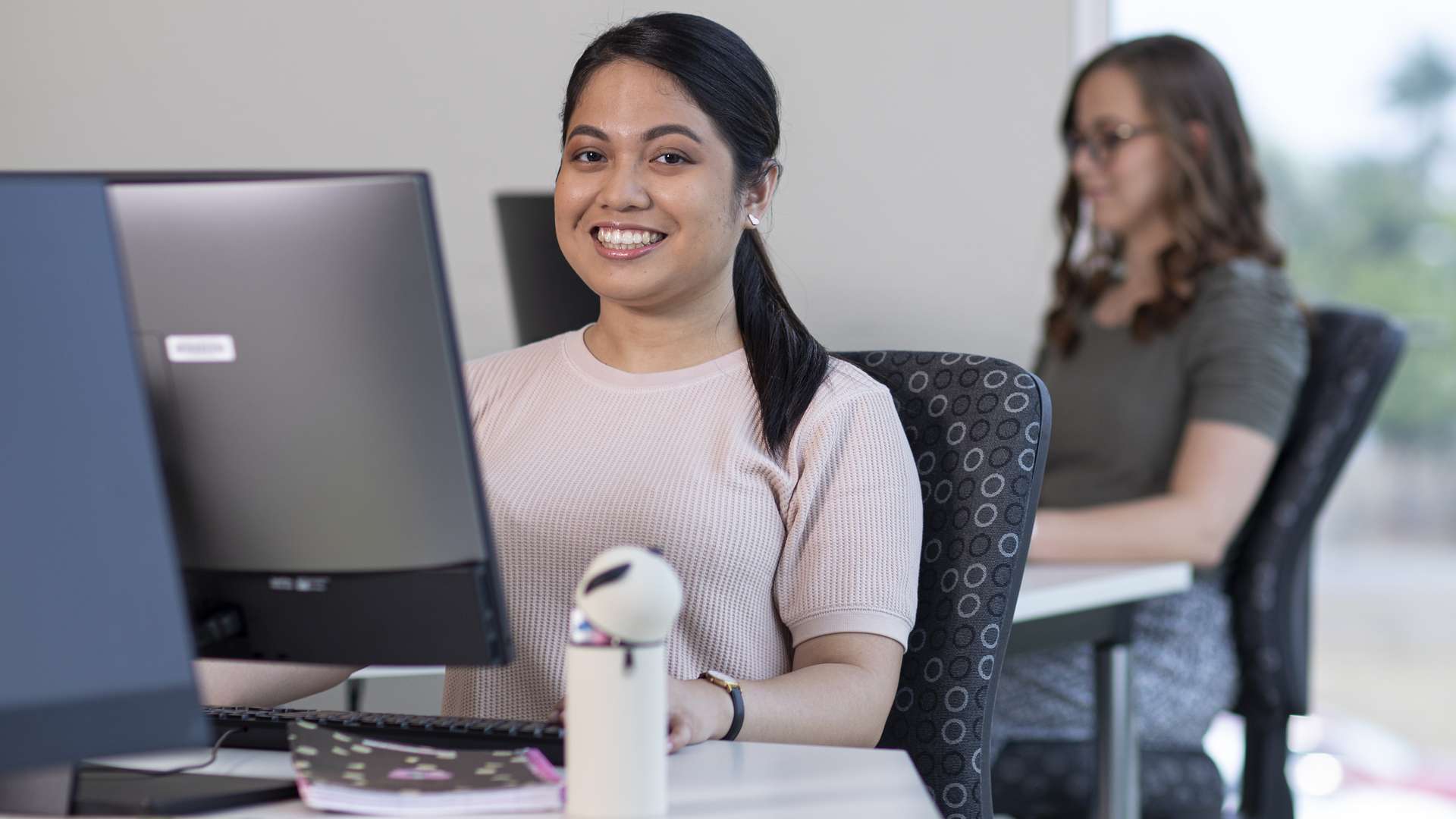 Student working at a desktop computer