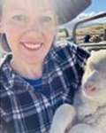 Emma Mclean holding a lamb