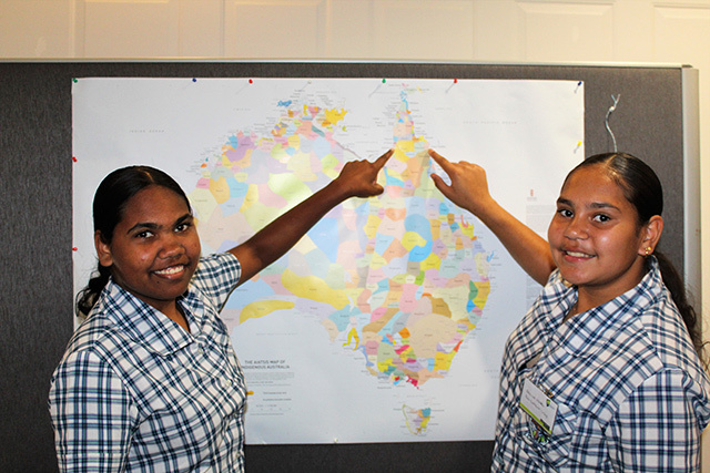 Keyonia Sinnamon & Alice-Lee Walker pointing to their home communities on the AIATSIS Indigenous Australia map