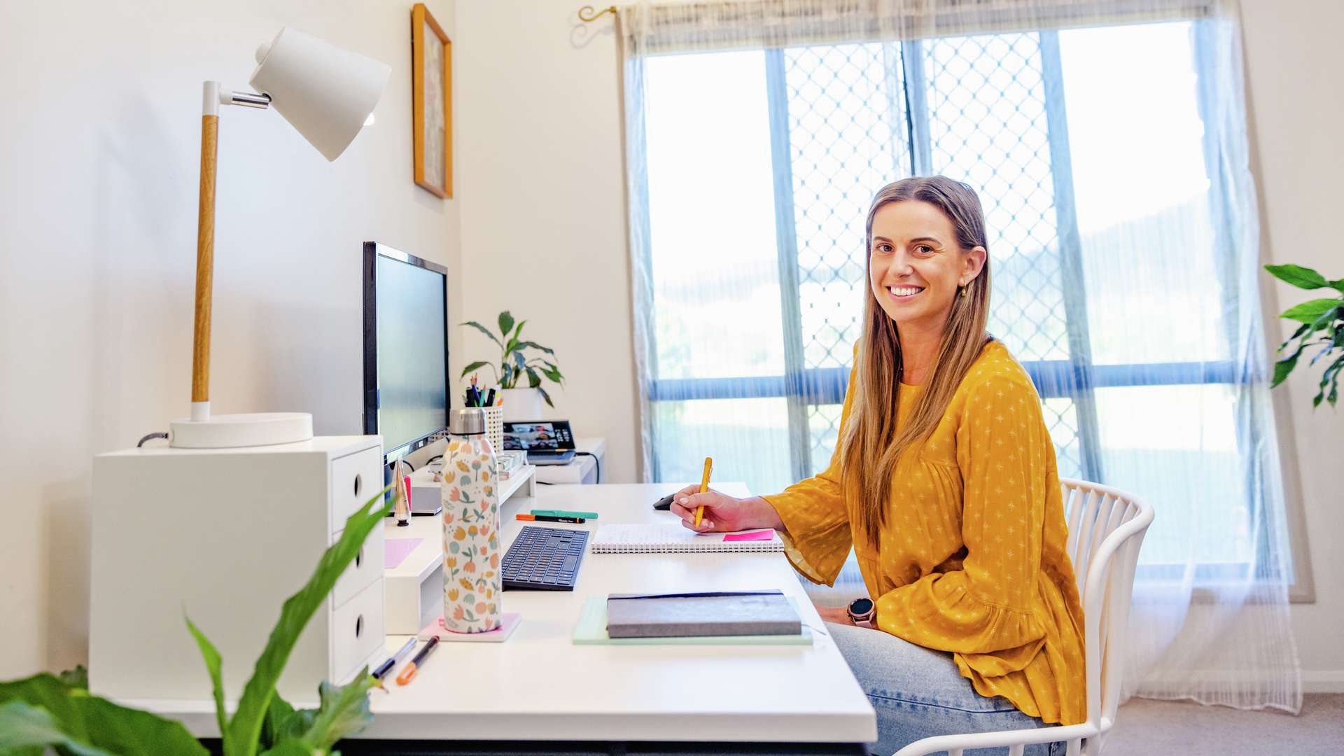 a student studying online from their home office