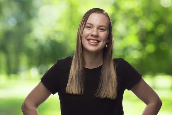 Amy Atkinson smiling with hands on her waist