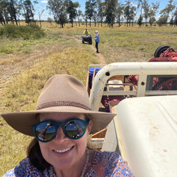 Angelique McInnes taking a selfie from a ute on a farm