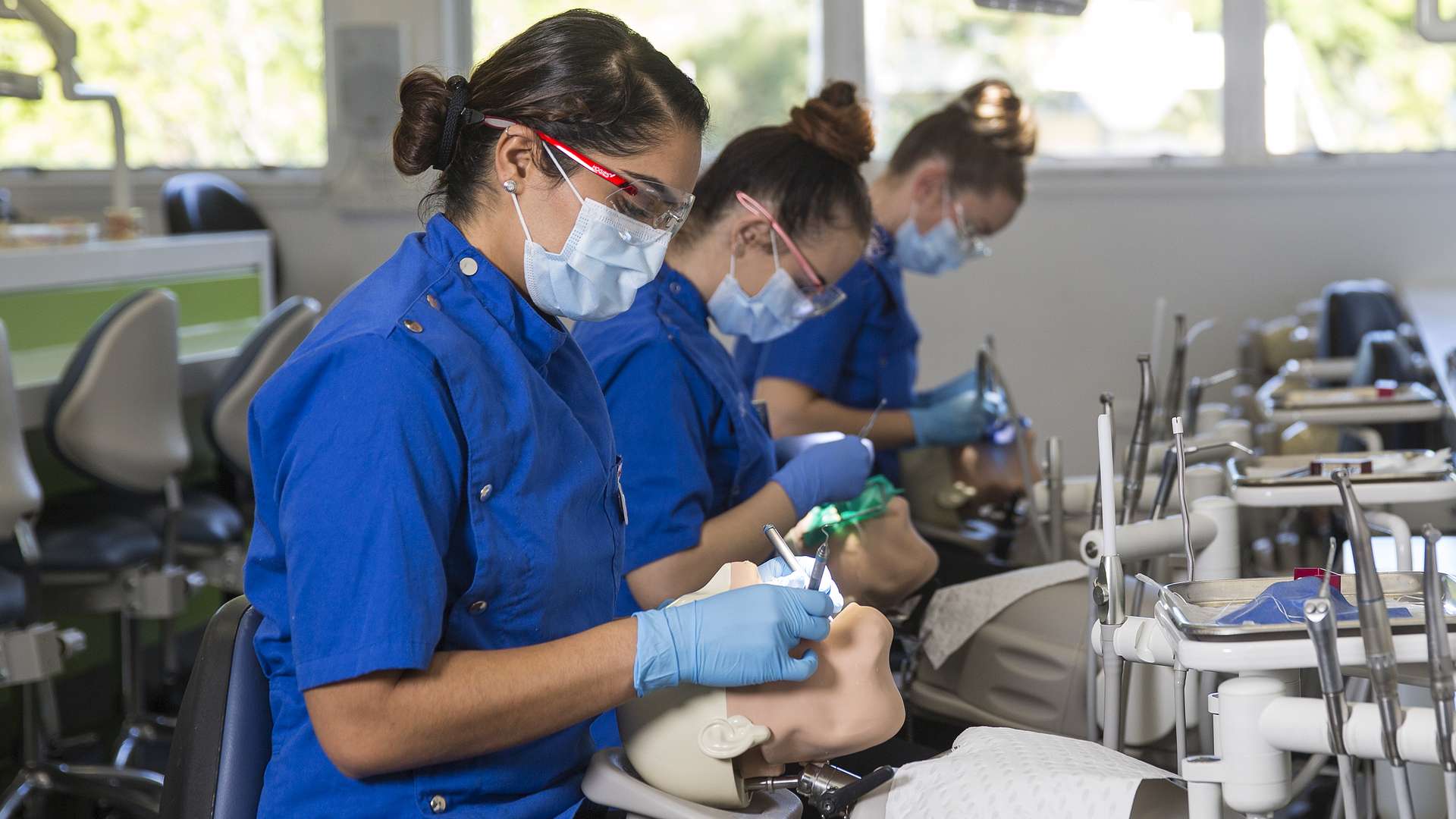 Students practicing oral health on dummies