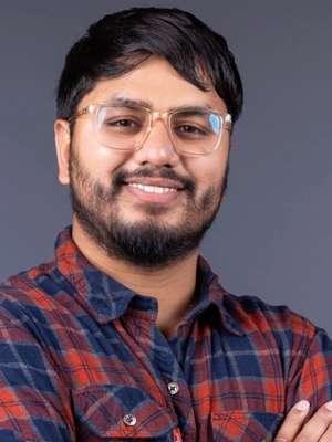 Bishnu Parajuli wearing glasses and smiling