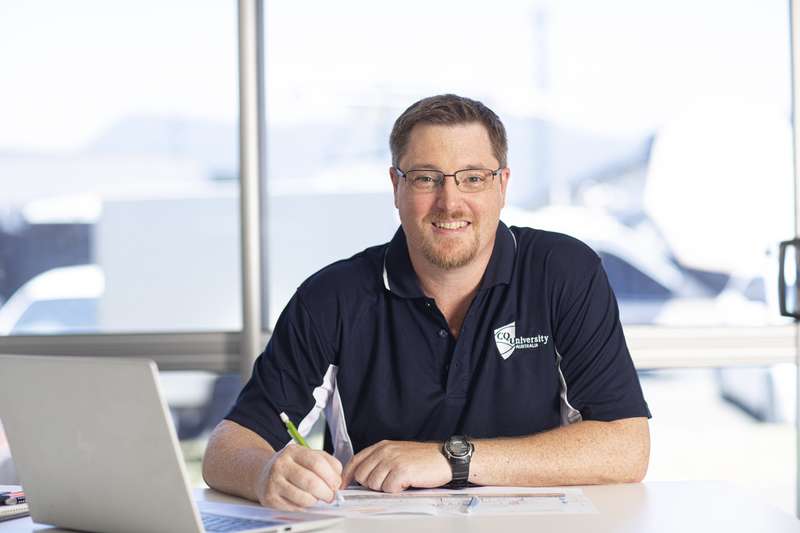 Academic marking assignments and smiling at the camera