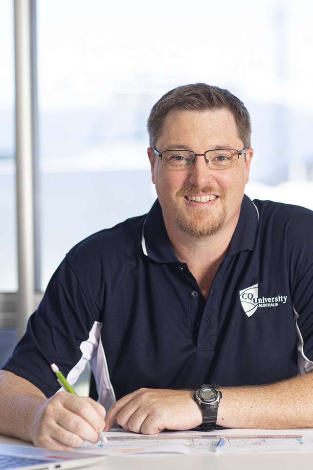 Academic marking assignments and smiling at the camera