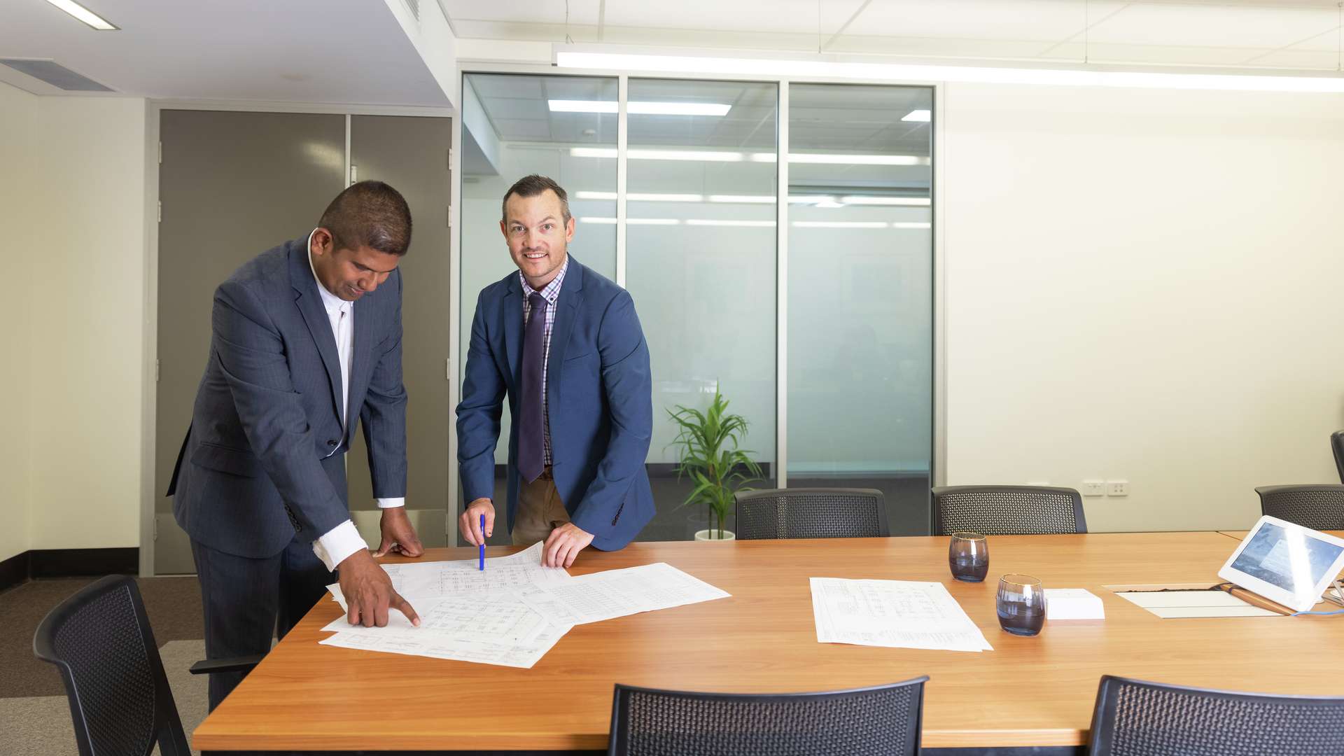 Construction Managers looking at documents.