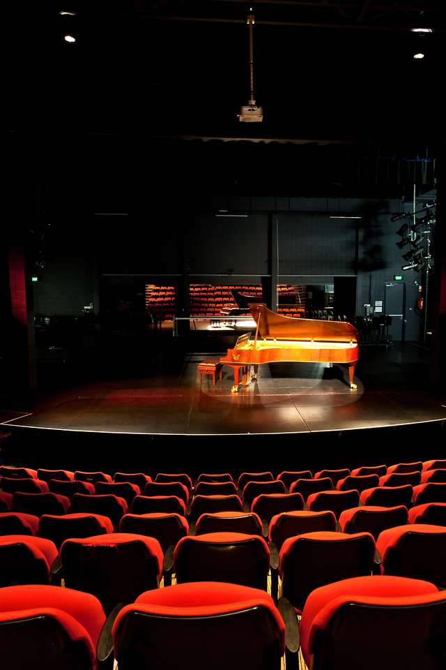 View from the seats in the CQCM Conservatorium looking at the stage with a piano on it