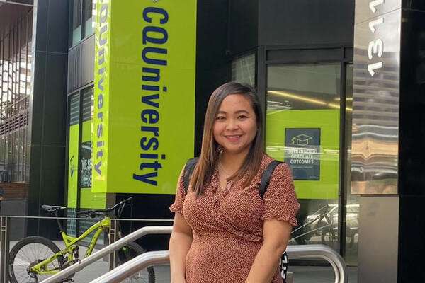 Ermalyn Edra Tambua standing outside the Brisbane campus