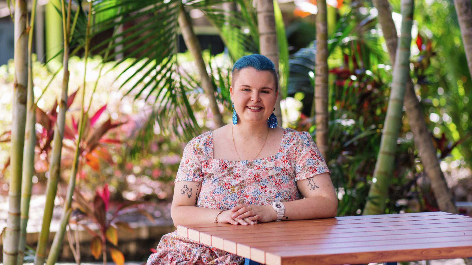 Mental Health Nursing student Rhiana Jackson sitting outside on campus