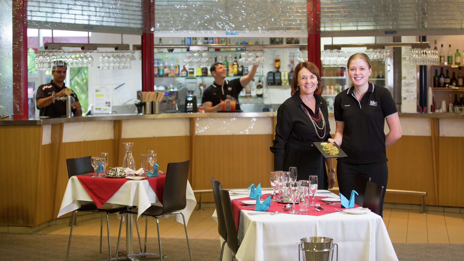 Hospitality students smiling at the camera