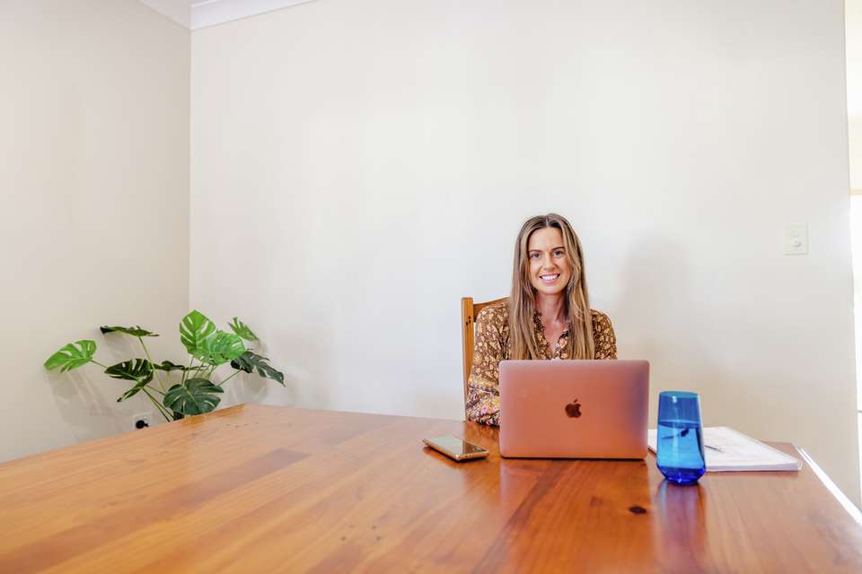 CQU student studies at a laptop at the dining table.