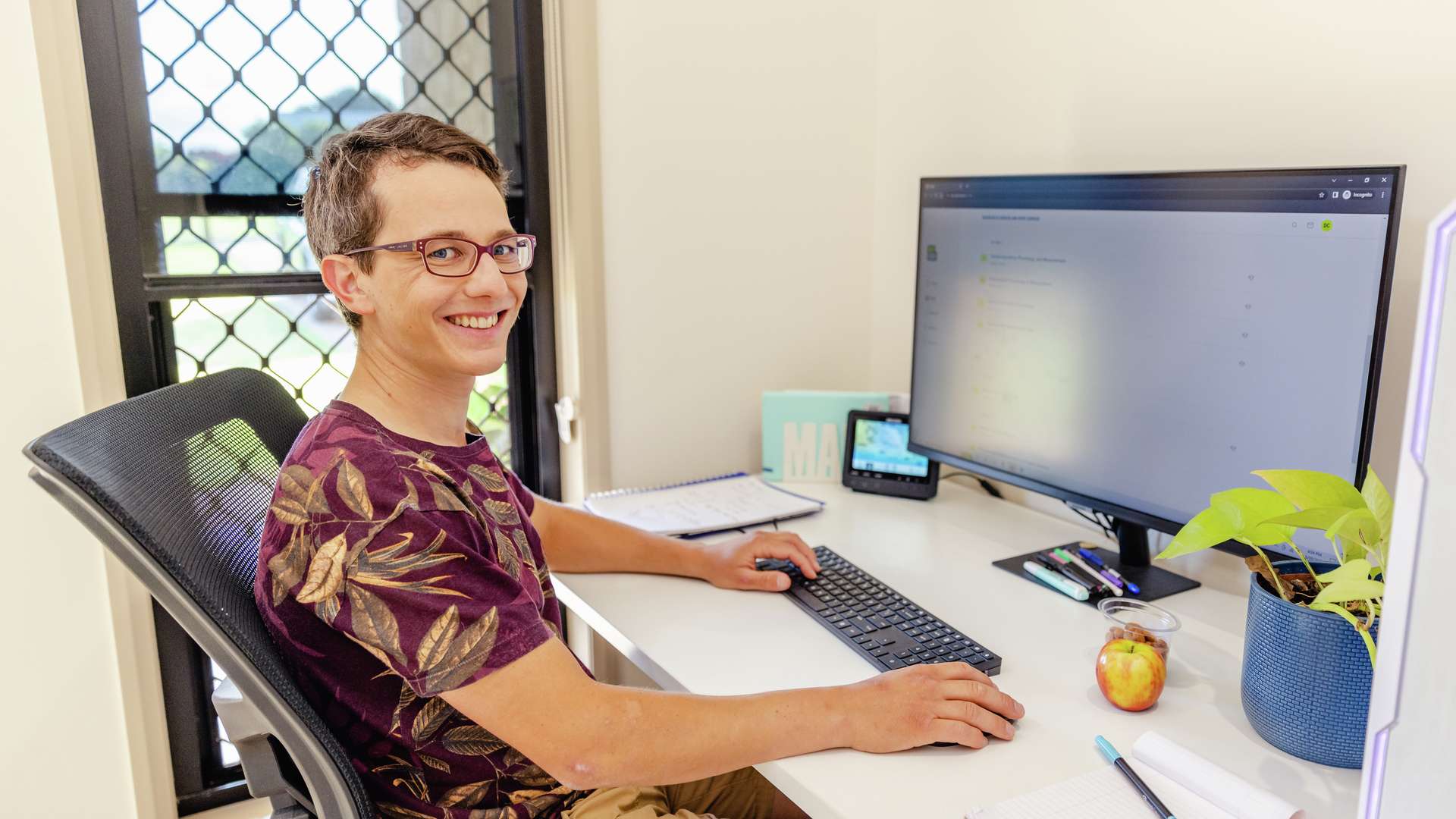 Student studying at home in a home office