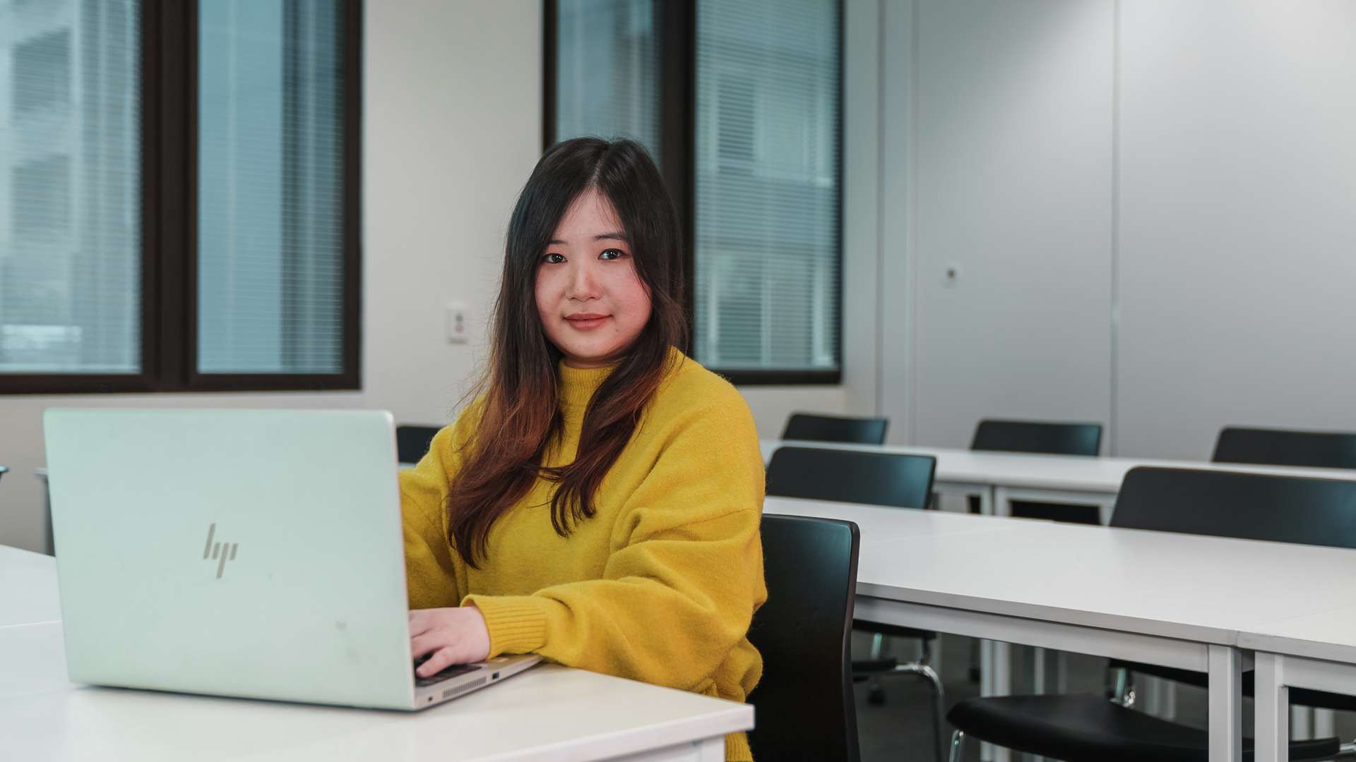 International student from Vietnam My Linh Le studies at her computer.