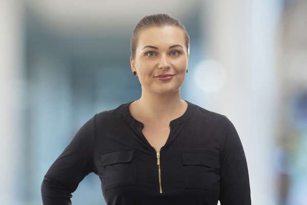 Jozanna Brown smiling bluer background