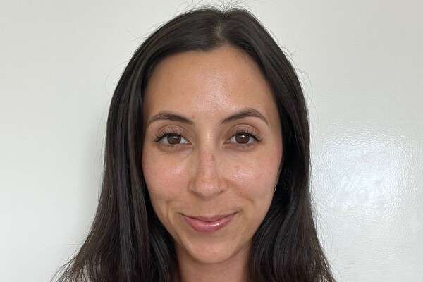 Alumna Kathy Miller wearing a white top.