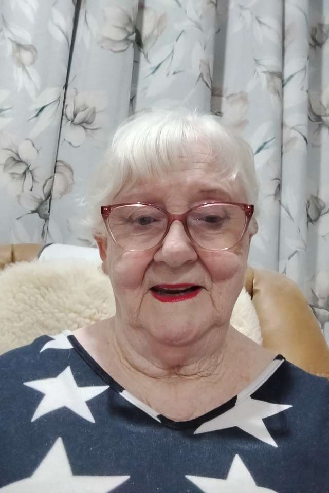 Alumna Kerry Simpson wearing a star top and glasses