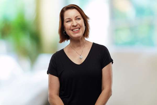 Leanne Rutherford smiling blurred background