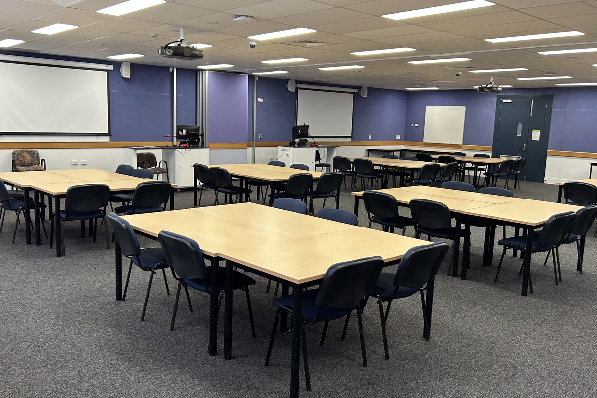 Larger classroom with table and chairs