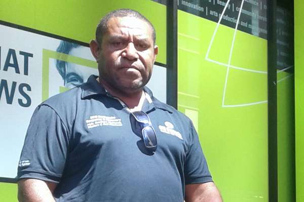 Leonard Mai Francis standing outside the CQUniversity Brisbane Campus.
