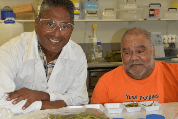 Mani Naiker and Uncle Steve Kemp sitting together smiling