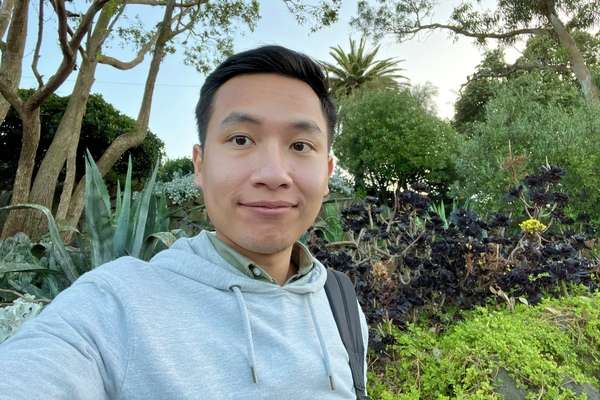 International student Marady Moeun from Cambodia wearing a hoodie and standing outdoors.