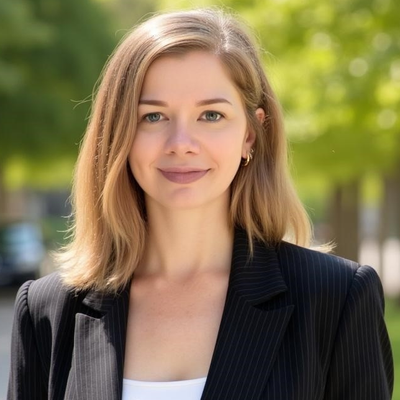 Heatshot of Michelle Gossner in black blazer smiling at the camera