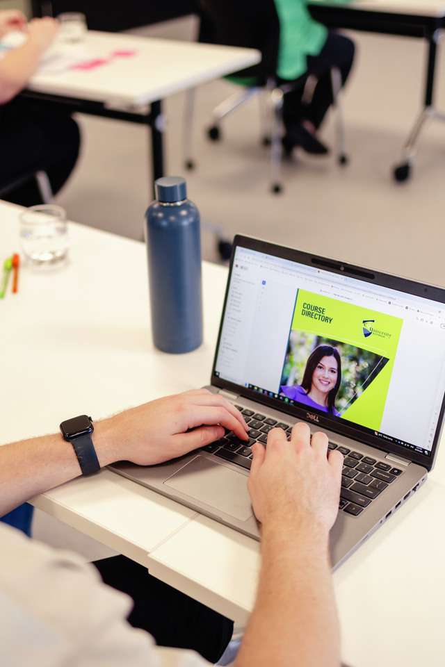 Student on laptop looking at course directory