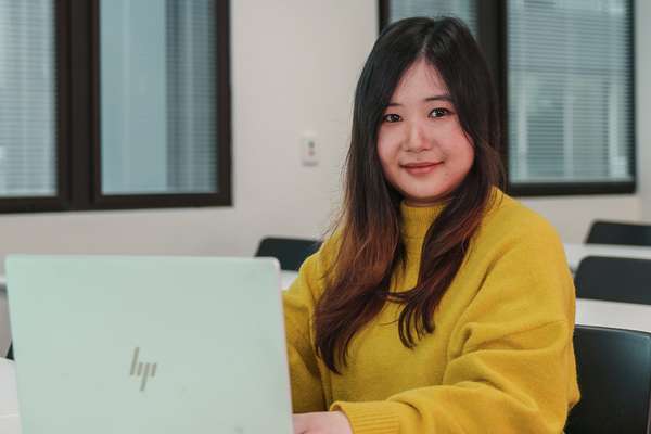 International student from Vietnam My Linh Le studies at her computer.