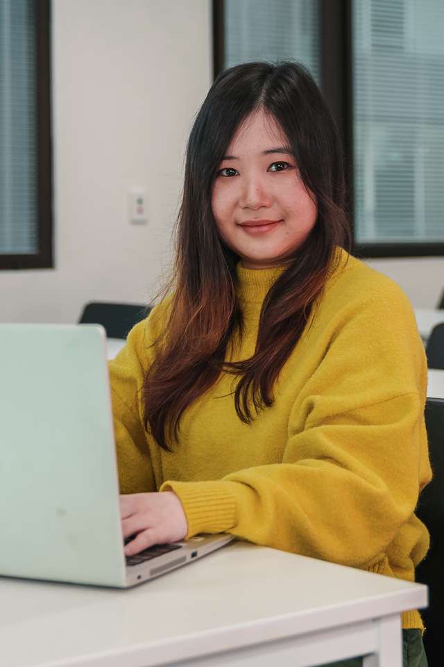 International student from Vietnam My Linh Le studies at her computer.