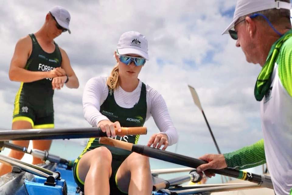Women in a hat and sunglasses in a boat