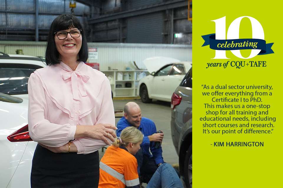 Kim Harrington standing in automotive workshop