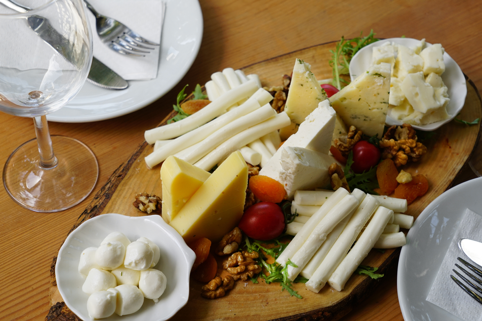 Various types of cheeses displayed on a platter