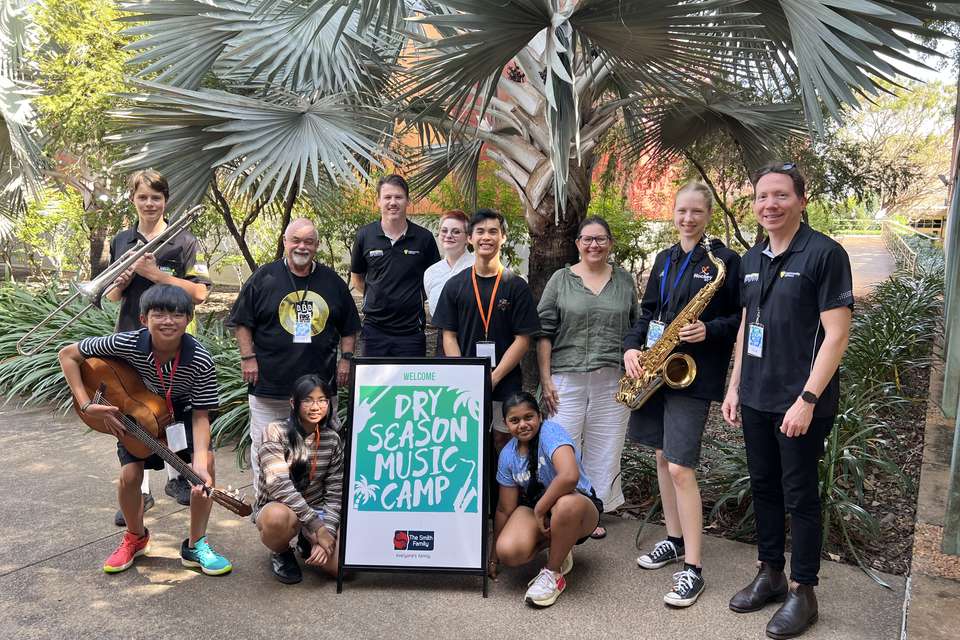Group of people standing with instruments
