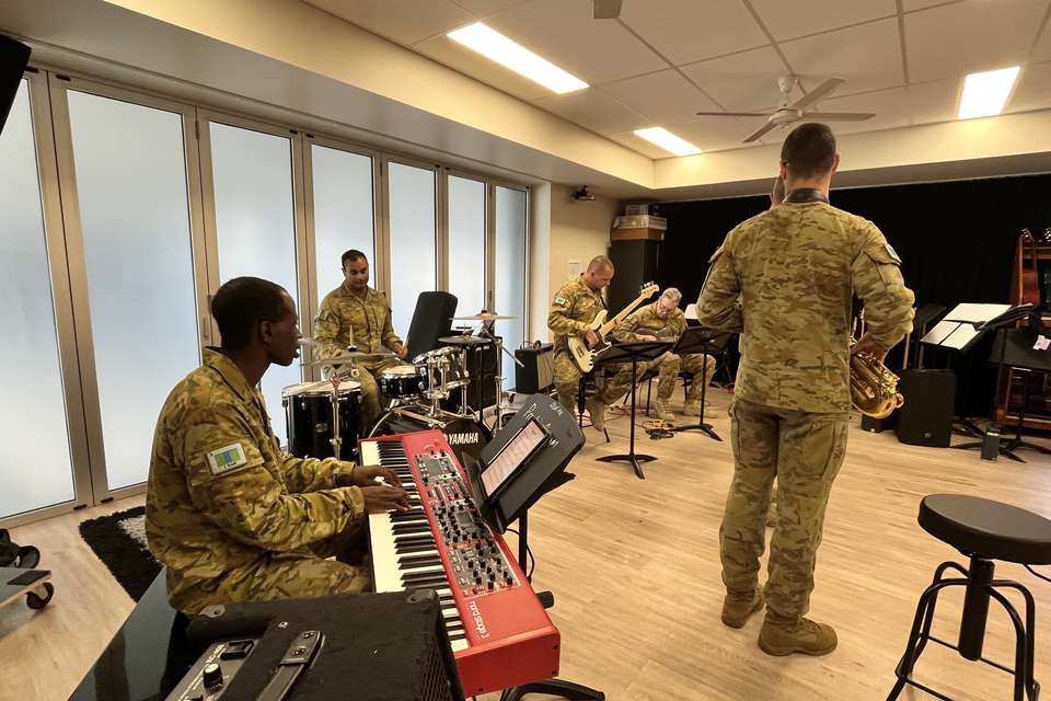 Man in Army uniforms playing instruments