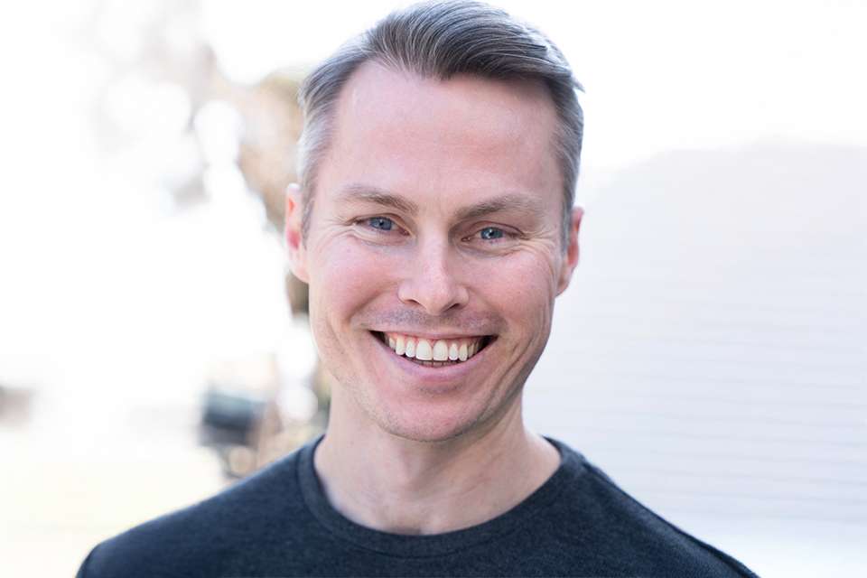 Headshot of man smiling at camera