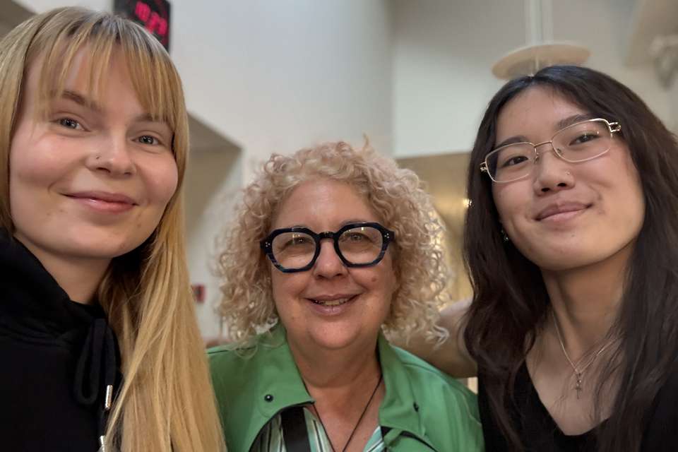 Three women smiling at camera