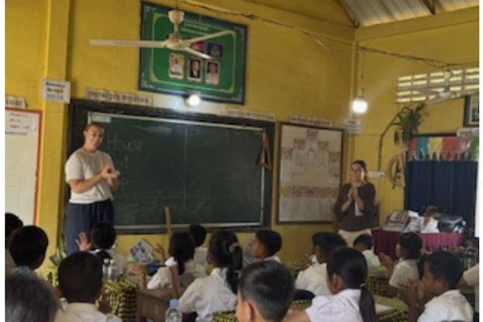 Two women teaching in a classroom