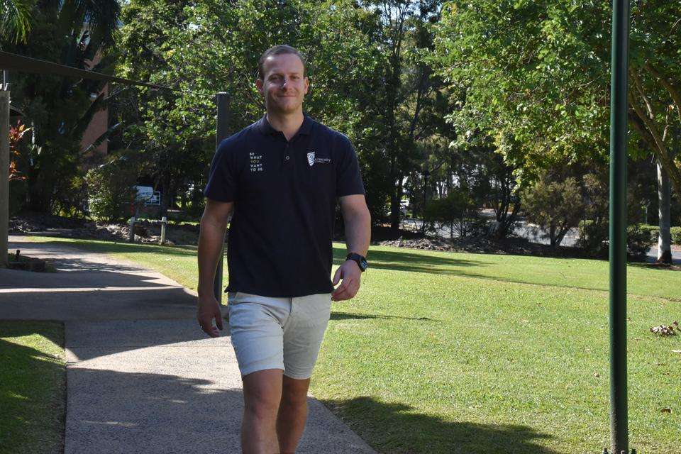 CQUniversity Head of Course for Podiatry, Dr Benjamin Peterson walking along a footpath