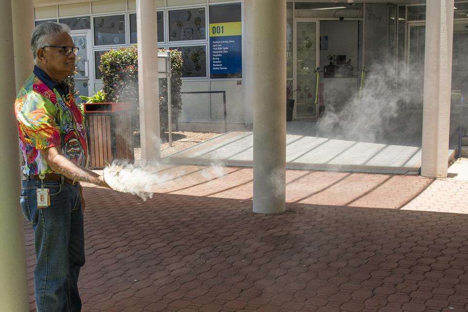 Uncle Philip Kemp undertaking a smoking ceremony