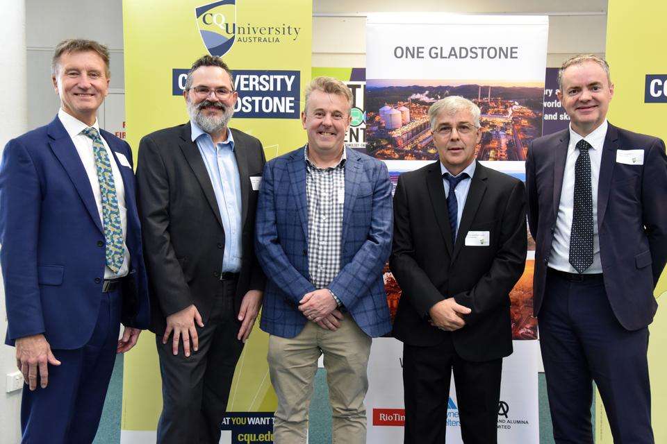 Five men stand in front of corporate banners L-R professor Nick Klomp (CQU),  Richard Jeffrey (Stanwell), Michael O'Rourke (Stanwell), Professor Jonathan Love (CQU), Paul Hodgson (CQU)