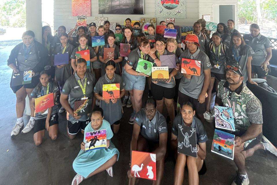 Indigenous Girls Academy group with their paintings