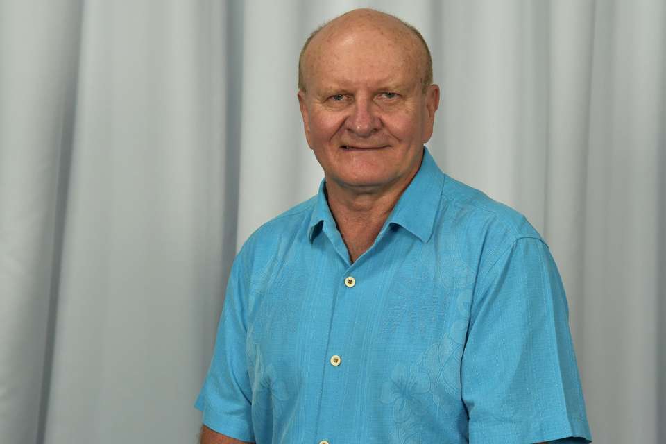 ken purnell with blue shirt on white background.jpg