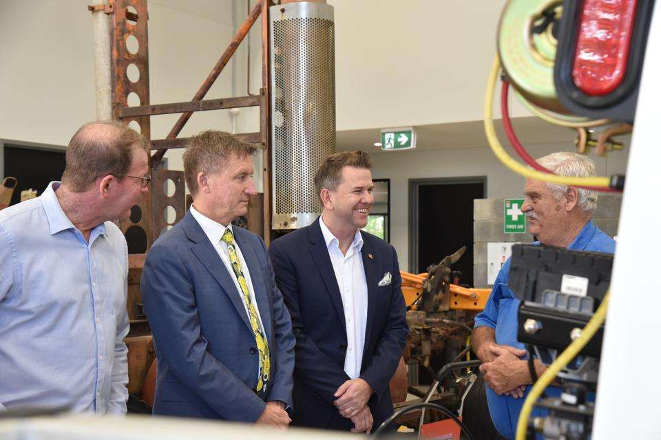 Deputy leader of the Queensland opposition Jarrod Bleijie and Professor Nick Klomp speak with a TAFE teacher in a workshop at the School of Mines in Rockhampton