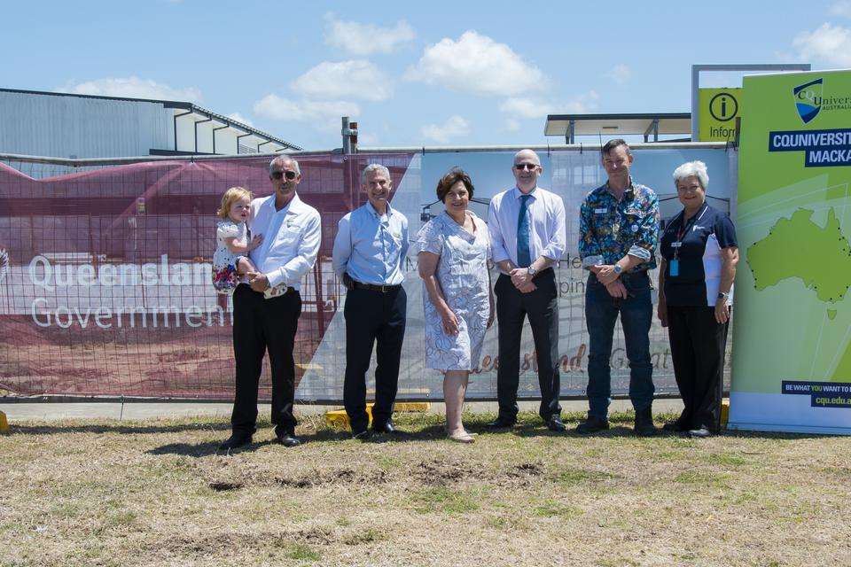 Group of dignitaries at the Mackay construction site of the Mackay heavy auto training facility