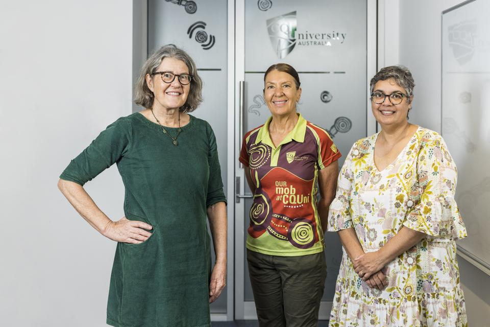 CQU Jawun researchers Prof Janya McCalman, Associate Professor Sandy Campbell and Ruth Fagan stand in an office.